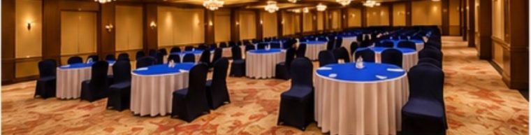 The banquet hall set with round tables